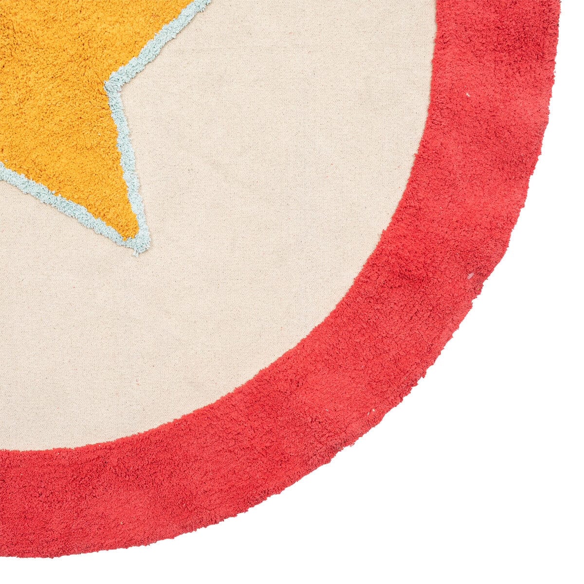Detail van speelmat Circus met een rode rand, beige vlak en een deel van de gele ster met lichtblauwe omlijning.