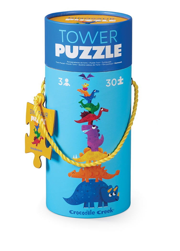 Tower Puzzel Dino in een blauwe opbergkoker met kleurrijke dinosaurussen en een geel touwhandvat.